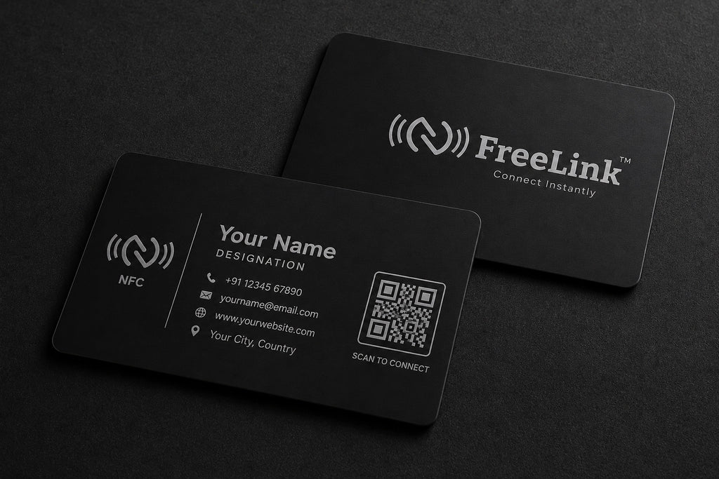 Black NFC business cards with FreeLink logo on table top and contact information on a dark background
